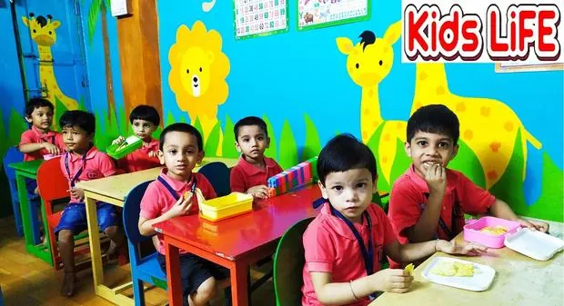 Kids at colourful desks